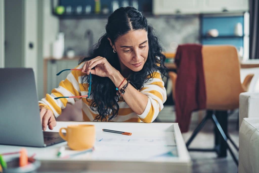 Self-employed woman checking the numbers - when to do your own tax return